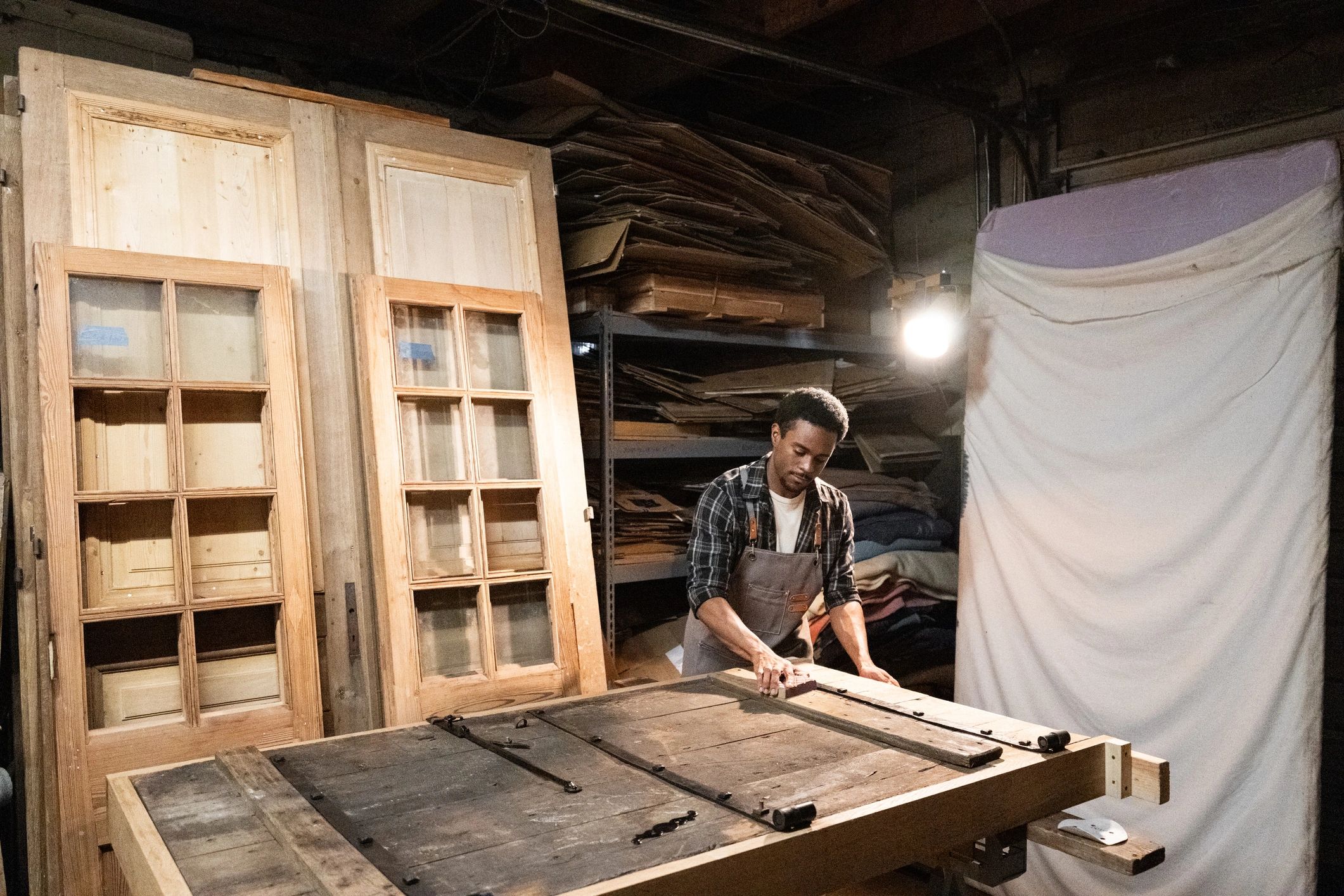 Woodworker shaping wood in a workshop